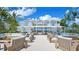 Large outdoor space with multiple seating areas and ocean views at 7665 Sanderling Rd, Sarasota, FL 34242