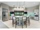 Modern clubhouse kitchen with island and stainless steel appliances at 7889 Mainsail Ln, Sarasota, FL 34240