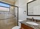 Bathroom with granite vanity and tiled shower at 12313 Baypointe Ter, Cortez, FL 34215