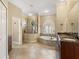 Large bathroom with soaking tub and walk-in shower at 12313 Baypointe Ter, Cortez, FL 34215