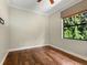 Bright bedroom with wood floors and large window at 12313 Baypointe Ter, Cortez, FL 34215