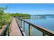 Wooden boardwalk offering scenic waterfront views at 12313 Baypointe Ter, Cortez, FL 34215