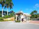 Gated community entrance with landscaped entryway at 12313 Baypointe Ter, Cortez, FL 34215