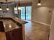 Kitchen with pool view from breakfast bar at 12313 Baypointe Ter, Cortez, FL 34215