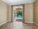 Main bedroom with access to the pool area at 12313 Baypointe Ter, Cortez, FL 34215