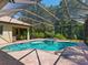 Inviting pool and spa with screened enclosure at 12313 Baypointe Ter, Cortez, FL 34215