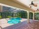 Relaxing pool and spa area with covered patio at 12313 Baypointe Ter, Cortez, FL 34215