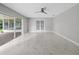 Spacious living area featuring marble floors and sliding glass doors at 5680 Blount Ave, Sarasota, FL 34231