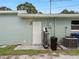 Side yard with access gate and utility area at 5680 Blount Ave, Sarasota, FL 34231