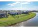 Aerial view of home showcasing backyard and water view at 14573 Ponce De Leon Trl, Port Charlotte, FL 33981