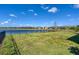 Spacious backyard with water view and privacy fence at 14573 Ponce De Leon Trl, Port Charlotte, FL 33981