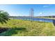 Private backyard with a lake view and a black metal fence at 14573 Ponce De Leon Trl, Port Charlotte, FL 33981