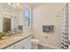 Bathroom boasts granite countertop and tiled shower at 14573 Ponce De Leon Trl, Port Charlotte, FL 33981