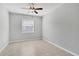 Bright bedroom with tile flooring and ceiling fan at 14573 Ponce De Leon Trl, Port Charlotte, FL 33981