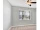 Well-lit bedroom with neutral walls and carpeted floors at 14573 Ponce De Leon Trl, Port Charlotte, FL 33981