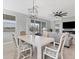 Bright dining room features a chandelier and seating for four at 14573 Ponce De Leon Trl, Port Charlotte, FL 33981