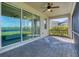 Screened patio with pavers, ceiling fan, and sliding glass doors at 14573 Ponce De Leon Trl, Port Charlotte, FL 33981