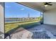 Enjoy the lake view from this screened patio with a ceiling fan at 14573 Ponce De Leon Trl, Port Charlotte, FL 33981