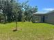 Large backyard with plenty of space for outdoor activities at 1702 Rada Ln, North Port, FL 34288