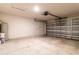 Clean and empty garage with overhead door and side door at 1702 Rada Ln, North Port, FL 34288