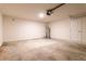 Empty garage with white walls, garage door, and concrete floor at 1702 Rada Ln, North Port, FL 34288