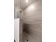 Walk-in shower with grey tile and glass enclosure at 1702 Rada Ln, North Port, FL 34288