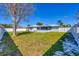 Expansive backyard, grassy lawn, and a white fence at 2806 67Th W St, Bradenton, FL 34209