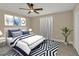 Spacious bedroom with a navy and white bedding set at 2806 67Th W St, Bradenton, FL 34209