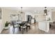 Kitchen dining area with round table, bench seating, and modern lighting at 2806 67Th W St, Bradenton, FL 34209