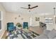 Bright living room with comfy seating, large windows and ceiling fan at 2806 67Th W St, Bradenton, FL 34209