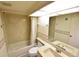 Bathroom with a shower/tub combo and single sink vanity at 3154 Windrush Bourne # 23, Sarasota, FL 34235