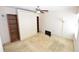 Bedroom with built-in shelving and a wall-mounted TV at 3154 Windrush Bourne # 23, Sarasota, FL 34235