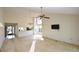 Bright living area with high ceilings, carpet, and views to the patio at 3154 Windrush Bourne # 23, Sarasota, FL 34235