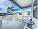 Covered deck with table and chairs, overlooking the mobile home park at 3333 26Th E Ave # 1230, Bradenton, FL 34208