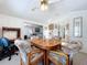 Dining area with wooden table and chairs near kitchen at 3333 26Th E Ave # 1230, Bradenton, FL 34208