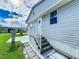 Exterior view showing home's siding and steps at 3333 26Th E Ave # 1230, Bradenton, FL 34208