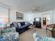 Living room with blue sofa and patterned armchairs at 3333 26Th E Ave # 1230, Bradenton, FL 34208