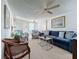 Living room with blue sofa and patterned armchairs at 3333 26Th E Ave # 1230, Bradenton, FL 34208