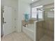 Relaxing bathroom featuring a soaking tub and a separate shower at 12271 Lavender Loop, Bradenton, FL 34212