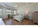 Main bedroom with wood flooring, and window seating area at 12271 Lavender Loop, Bradenton, FL 34212