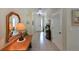 Inviting entryway with a wooden console table and elegant mirror at 12271 Lavender Loop, Bradenton, FL 34212