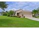 Beautiful one-story home with landscaped lawn and two-car garage at 12271 Lavender Loop, Bradenton, FL 34212