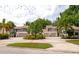 Community of townhouses with circular driveway and mature trees at 4540 Ascot N Cir, Sarasota, FL 34235