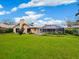 Home exterior view, showcasing the backyard at 5050 Kestral Park S Way, Sarasota, FL 34231