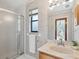 Updated bathroom with walk-in shower and vanity at 5050 Kestral Park S Way, Sarasota, FL 34231