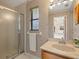 Small bathroom with shower and vanity at 5050 Kestral Park S Way, Sarasota, FL 34231