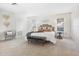 Spacious bedroom with plush carpet and natural light at 5050 Kestral Park S Way, Sarasota, FL 34231