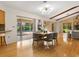 Bright dining area with hardwood floors and view of the pool at 5050 Kestral Park S Way, Sarasota, FL 34231