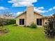 Back of house with sliding glass doors at 5050 Kestral Park S Way, Sarasota, FL 34231