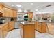 Large kitchen with island and views to Gathering room at 5050 Kestral Park S Way, Sarasota, FL 34231